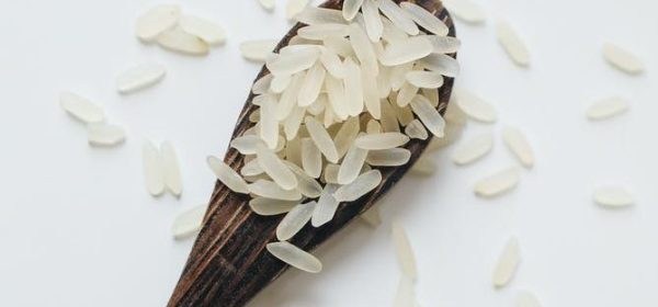 photo of rice on wooden spoon